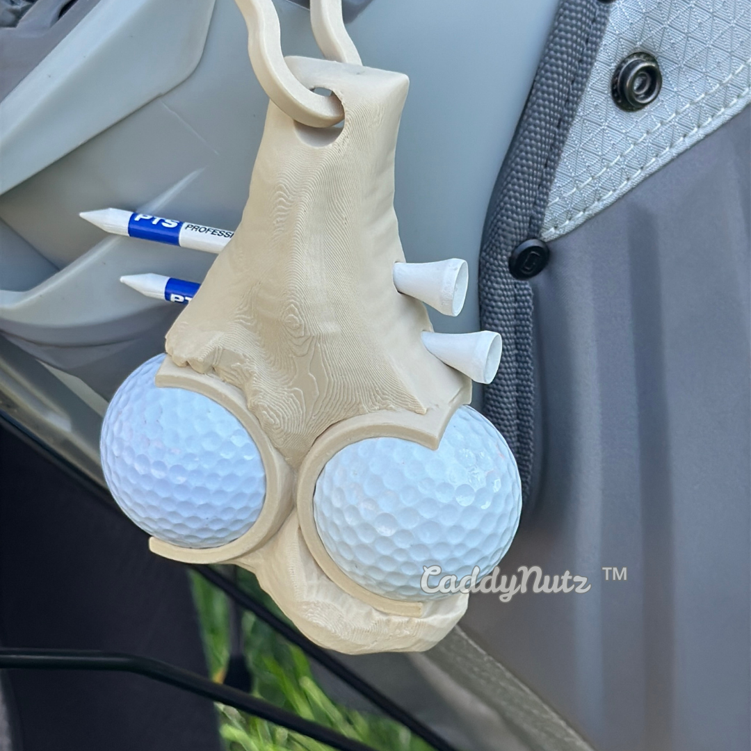 Funny Golf ball holder with golf balls attached to a vehicle, featuring the brand 'CaddyNutz'.