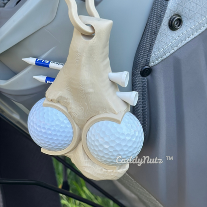 Funny Golf ball holder with golf balls attached to a vehicle, featuring the brand 'CaddyNutz'.