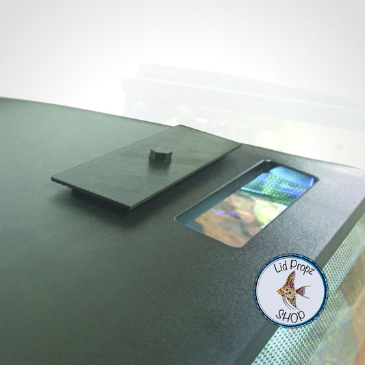 Image shows a custom 3D printed feed cover designed specifically for the Fluval Flex 9 gallon and 15 gallon aquariums. This cover fits precisely over the feeding hole located on the top of Fluval Flex aquariums, offering both protection and convenience. Available in sleek black and clean white, the cover blends seamlessly with your tank’s aesthetic while keeping dust, debris, and curious pets or children out of the feeding bay.