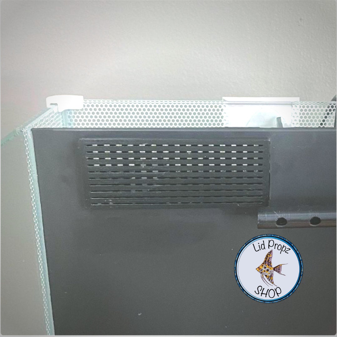 Close-up of intake cover installed on a Fluval Spec filter. The snug-fit cover protects shrimp and fry from entering the filter while maintaining water flow.